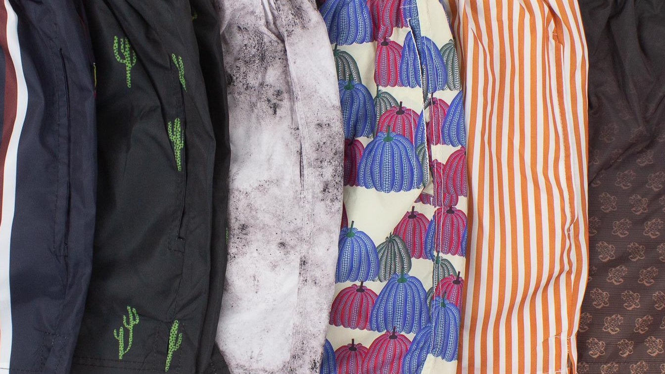 Collection of various pairs of shorts on a white background