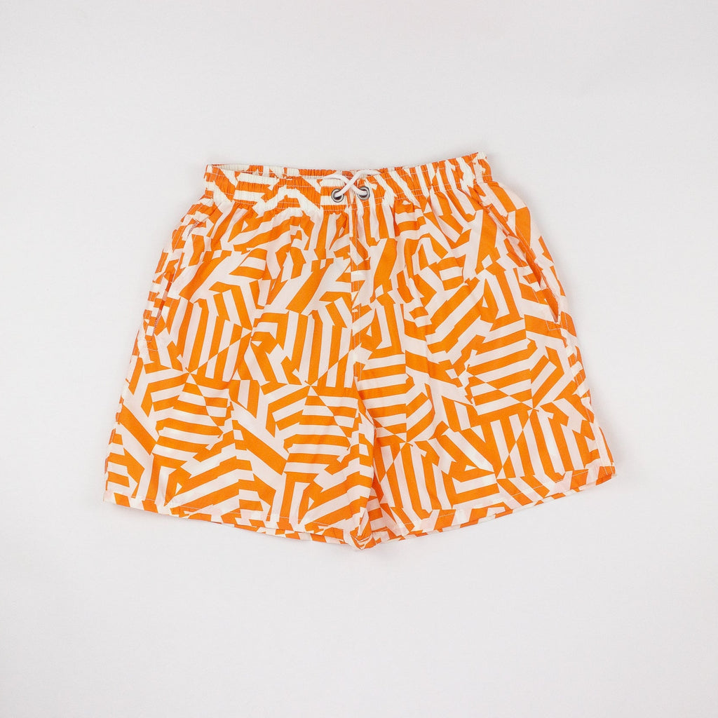 Orange and white patterned shorts on a light gray background